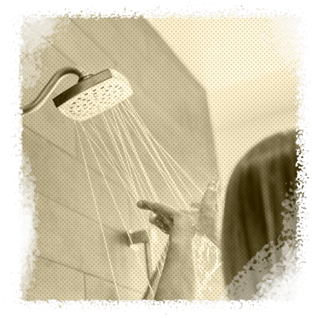 Lady checking water temperate in shower with hands